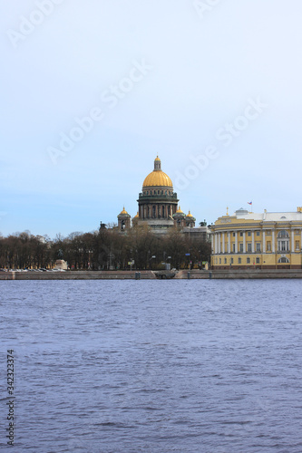 Neva river spring day view with with Saint Isaac's cathedral dome in Saint Petersburg, Russia. Cityscape scenery of Saint Petersburg city on moody day, vertical postcard image