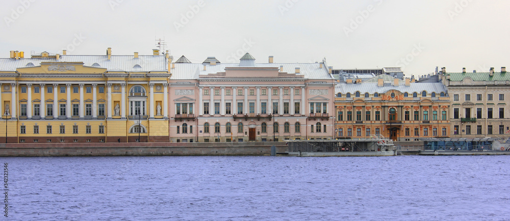 Saint-Petersburg cityscape scenic view with old historic buildings on Neva river in Russia. Decorative residential house facades in Saint Petersburg city downtown. European old townscape scenery