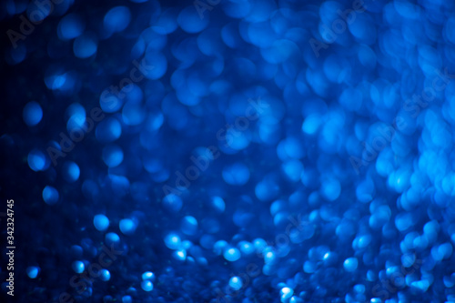 Abstract blue glitter background. Shiny glitter bokeh christmas background