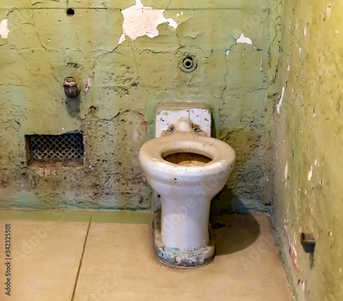 Broken rusty and dirty sink and toilet bowl from a cell at Alcatraz Prison San Francisco California USA