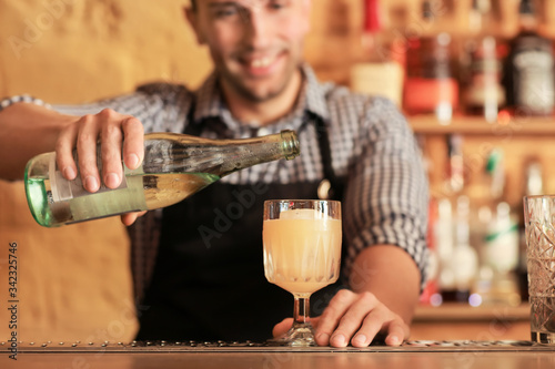 Bartender making cocktail i...