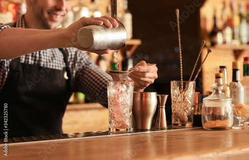 Bartender making cocktail i...
