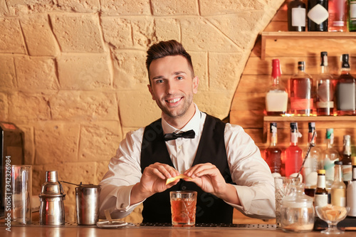 Male bartender making cockt...
