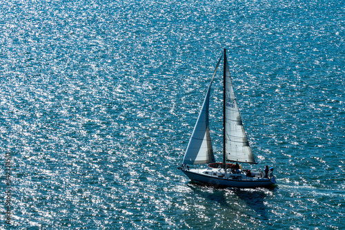 Sailboat while cruising the san francisco bay near the Alcatraz island prison