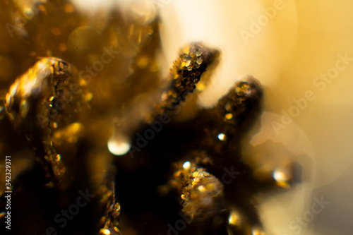 Abstract golden background with bokeh. holidays lights on background © CravenA