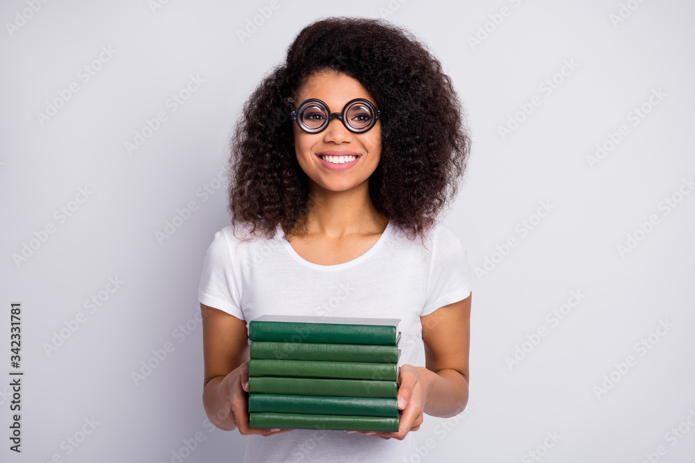 Close-up portrait of her she nice attractive cheerful cheery wavy-haired girl nerd wearing thick specs holding in hands pile stack materials isolated over light white pastel color background