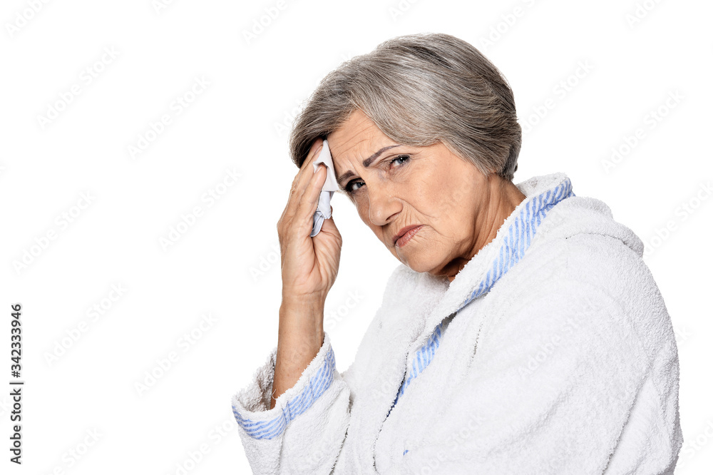 Serious senior woman with headache, isolated on white Serious senior woman with headache, isolated on white