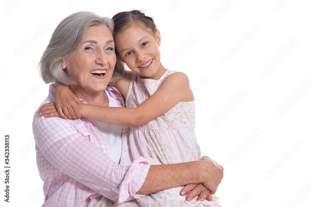 Grandmother hugging with her cute granddaughter isolated Grandmother hugging with her cute granddaughter isolated