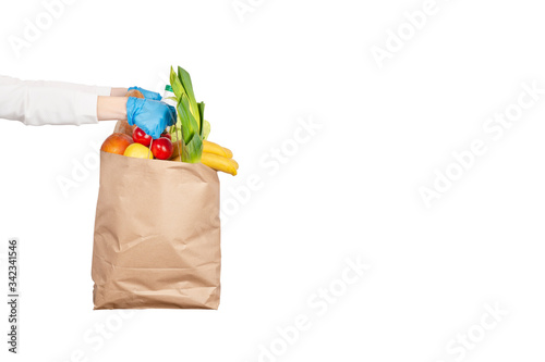 Safe food delivery or donation concept. Paper bag with different food ingredients.