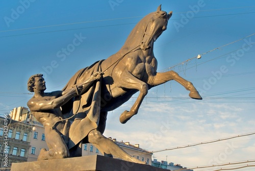 Horse tamers monument by Peter Klodt on Anichkov Bridge in Saint-Petersburg Russia.   © Ekaterina Bykova