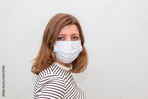 woman wearing an anti-virus protection mask to prevent flu infection, allergies, virus protection, COVID-19, and corona virus pandemic disease 2019