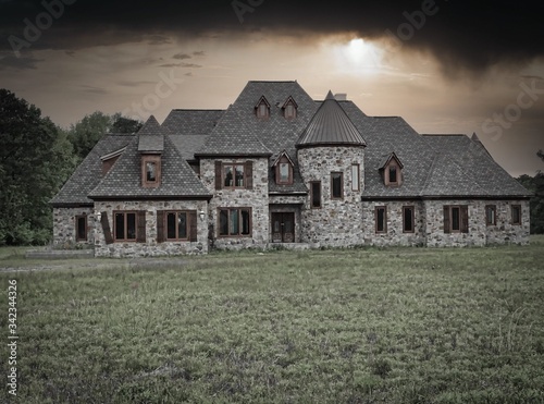 Fototapeta Naklejka Na Ścianę i Meble -  Spooky house with ominous sky