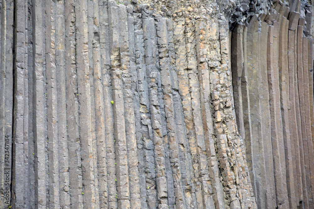 Iceland - August 29, 2017: Basaltic columns details of Litlanesfoss waterfall, Iceland, Europe