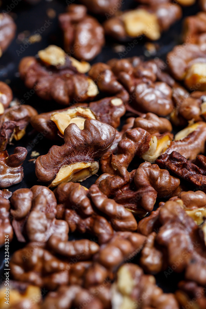 Roasted walnuts. Nuts help the brain work. Fatigue Food, Healthy Nuts. Superfood, vegan, vegetarian food concept. Macro of walnut texture, selective focus. Healthy snack. Roasted walnuts. Nuts help the brain work. Fatigue Food, Healthy Nuts. Superfood, vegan, vegetarian food concept. Macro of walnut texture, selective focus. Healthy snack.