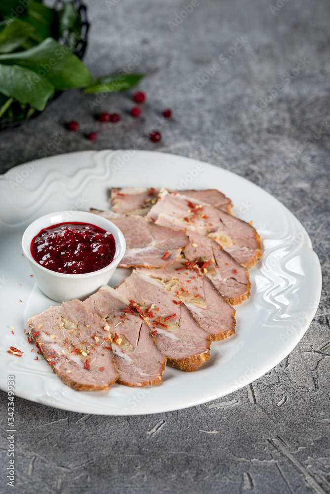 Boiled pork with sauce on a white glass plate Boiled pork with sauce on a white glass plate