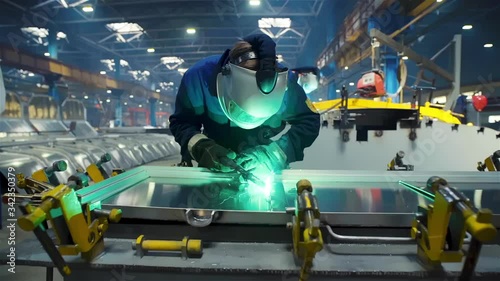 Train wagon manufacture railcar manufacturer Welding Soldering the Steel Structure Bright Blue Green Light Sparks Welding Machine Dolly Out