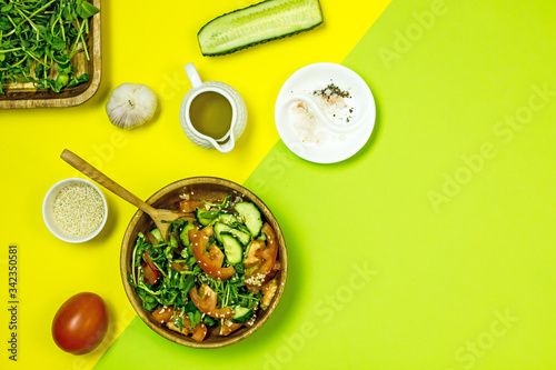 Wallpaper Mural Veggie vegetable salad in a wooden bowl on a yellow background, top view, flat lay Torontodigital.ca