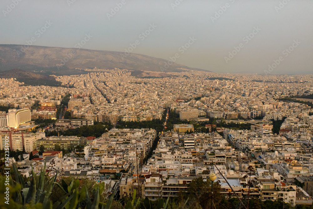 Panorama of the evening city with Lycabettus Hill