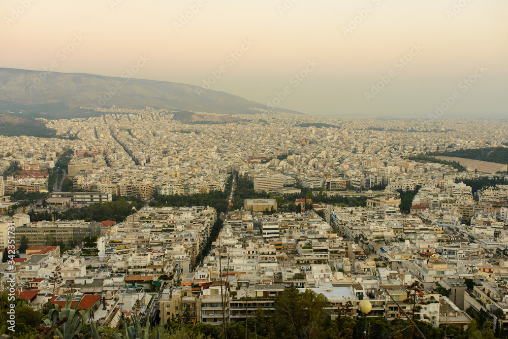 Panorama of the evening city with Lycabettus Hill