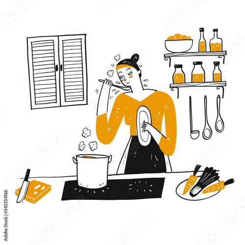 A young woman cooks in her kitchen.
