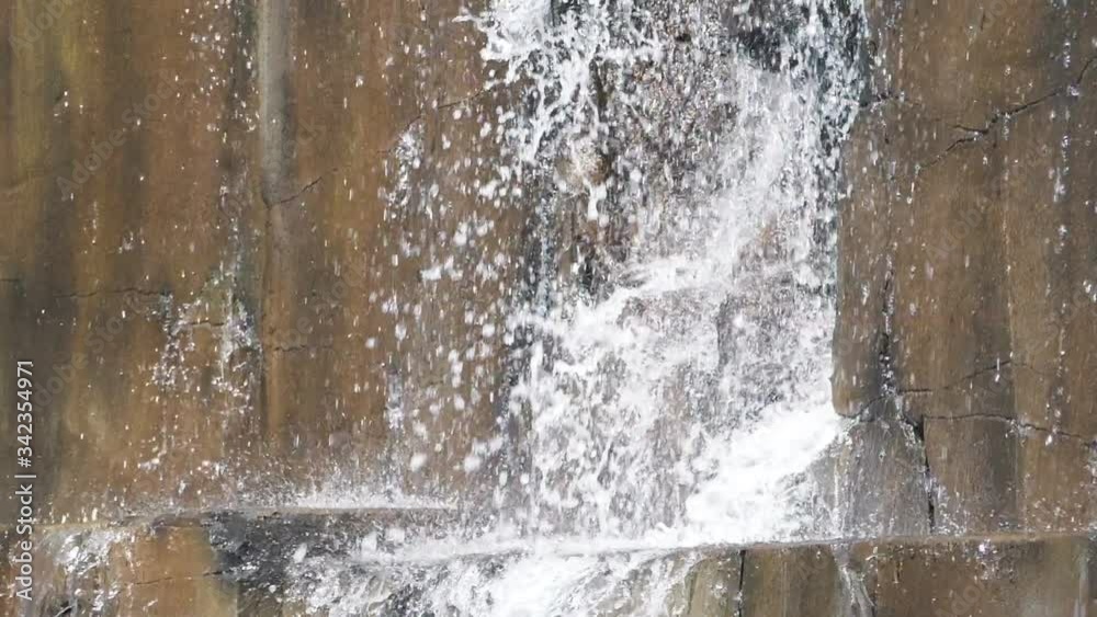 Water dropping through the rocky wall in slow motion 180fps Water dropping through the rocky wall in slow motion 180fps
