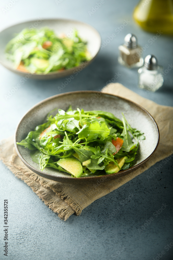 Avocado salad with fresh tomato and arugula Avocado salad with fresh tomato and arugula