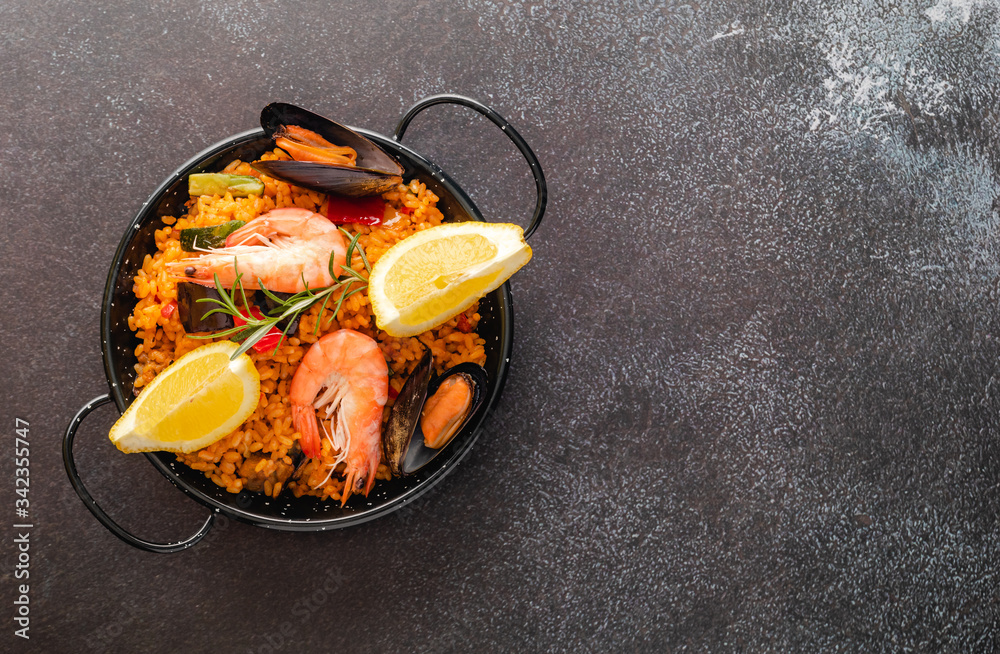 Vegetable paella with seafood, top view and copy space Vegetable paella with seafood, top view and copy space