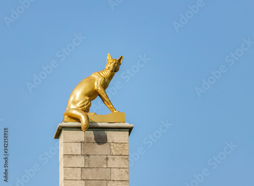 Gilded statue on top of Guildhouses view from Grand Market Square in Antwerp, Belgium