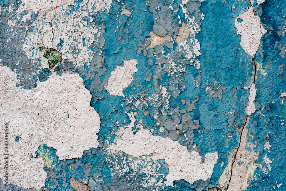 Texture of a concrete wall with cracks and scratches which can be used as a background