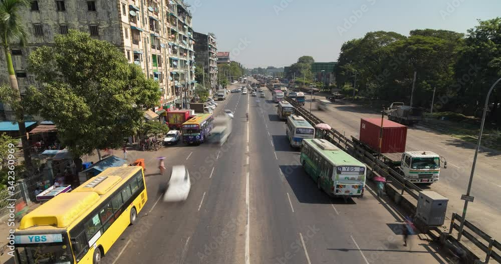 Timelapse of traffic in Yangon city, Downtown district, just above Strand Road, taken from the crosswalk, looking to the est.