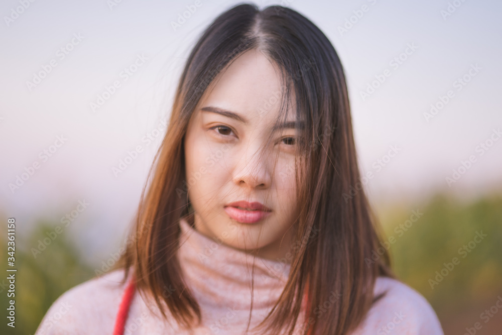 Portrait of beautiful Asian young woman smiling.