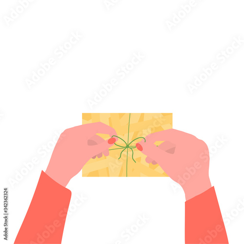 Person ties or unties green ribbon on a gift. Hand with gift. Trendy vector hand drawn, doodle illustration.