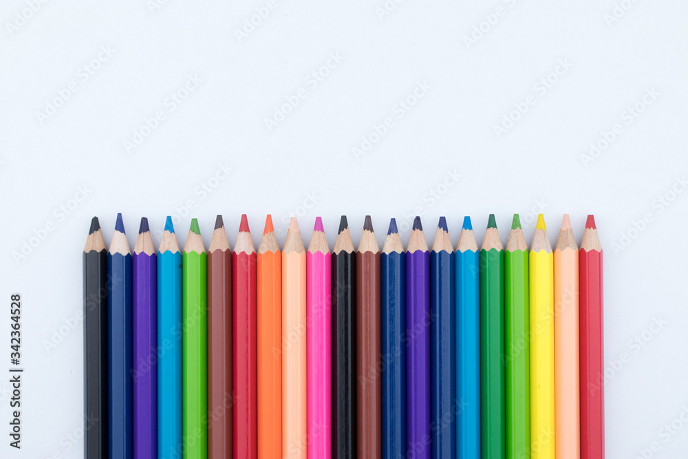 Colored pencils isolated in line on white background Colored pencils isolated in line on white background
