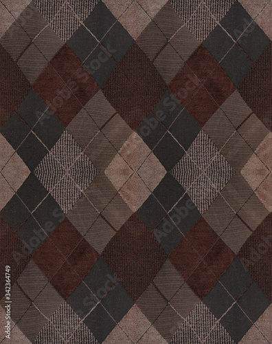 Dense Argyle fabric. The pattern on the fabric is a beige-brown rhombus. Seamless. photo