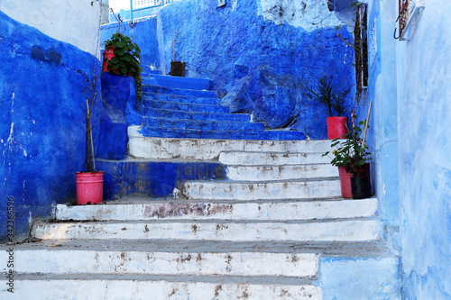 Chefchaouen, Morocco - 02.24.2019: View from the city street where all buildings are painted only in blue. © Nadzeya