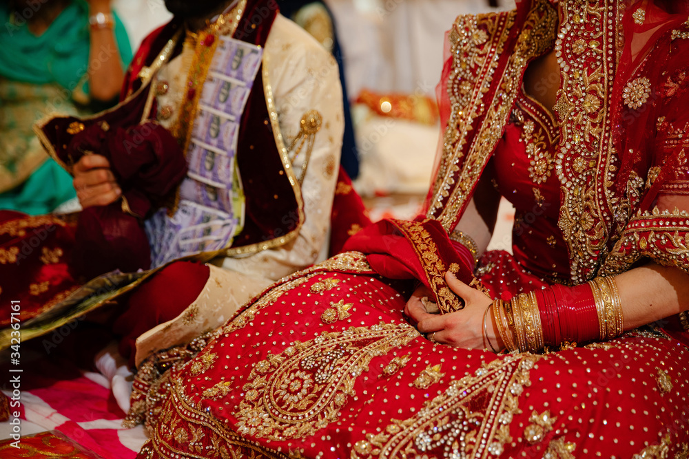 Indian wedding. National costume of the bride in red