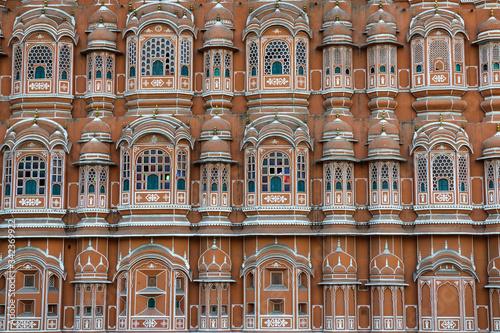 Hawa Mahal is a palace in Jaipur, India. Made with the red and pink sandstone, the palace sits on the edge of the City Palace, Jaipur, and extends to the Zenana, or women's chambers.