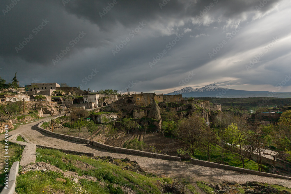 Obraz premium Guzelyurt city spring landscape dramatic cloudy sky Cappadocia 