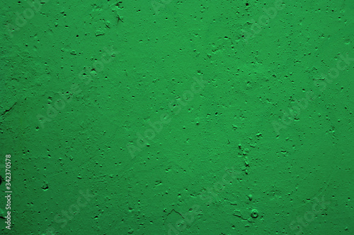 Background plasticine green surface. Texture of green plasticine with holes