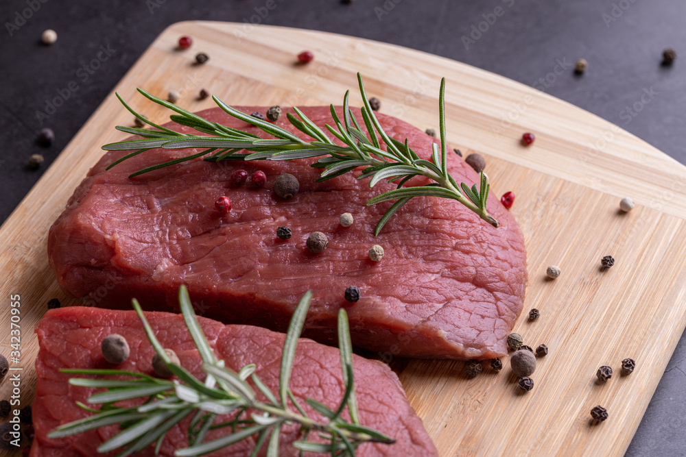 fresh raw sliced beef meat steak on a wooden board fresh raw sliced beef meat steak on a wooden board