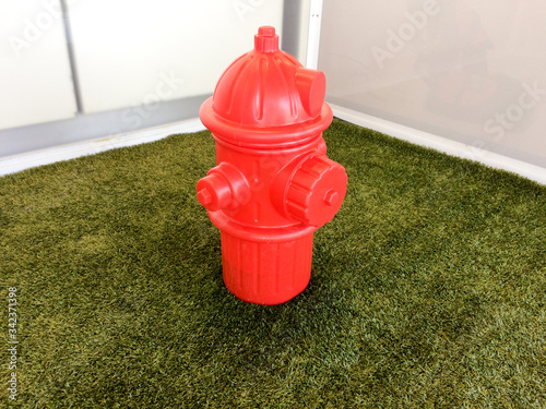 Dog restroom fake grass with fire hydrant in airport