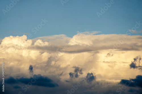 The evening sky with white clouds blurred with the patterned blur background