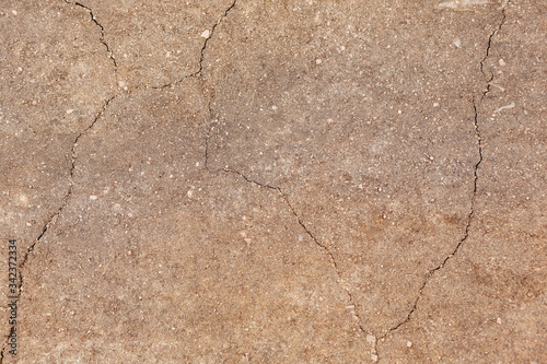 Background texture earth sand stones brown with cracks