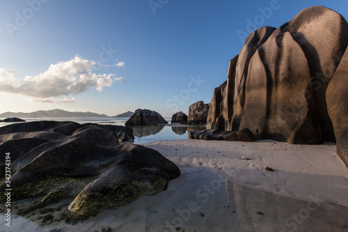 фотографія source d'argent beach low tide water Indian ocean colorful sunset view