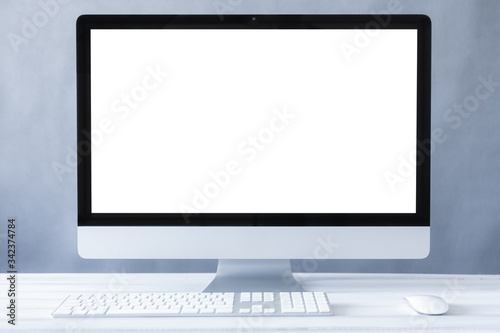 Computer all in one mockup, home and office workspace concept. Computer white blank screen on work table front view. Copy space