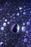 Water drops crystal on dark purple background