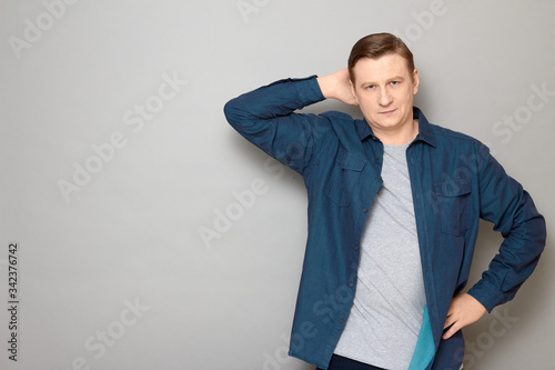 Portrait of happy confident man standing in relaxed position