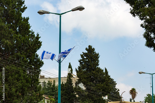 Fotografie Israeli flags showing the Star of David hanging proudly for Israel's Independenc