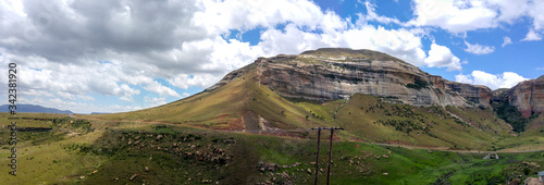 Fluffy clouds over rock formations in the Golden Gate Highlands National Park, Clarens, Free State, South Africa