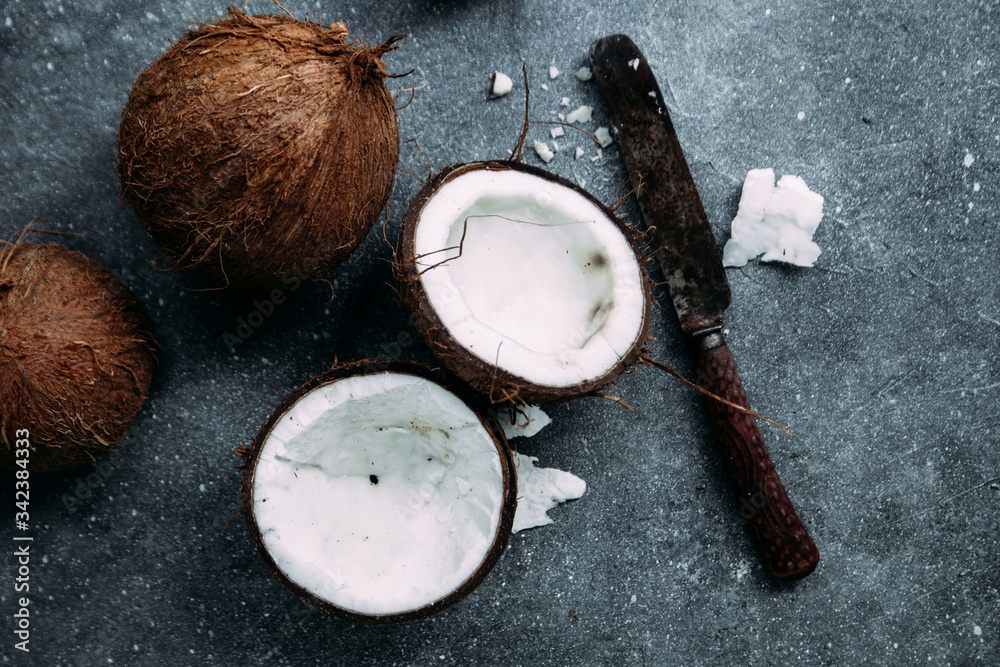 Coconuts on concrete gray background close-up Coconuts on concrete gray background close-up